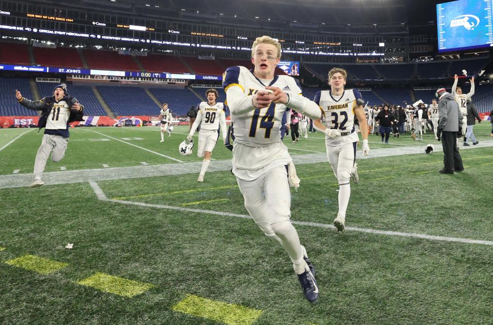Xaverian quarterback Henry Hasselbeck leads the team toward the student section at the conclusion of the Division 1 state title game versus St. John's Prep at Gillette Stadium on Wednesday, Nov. 29, 2023.
