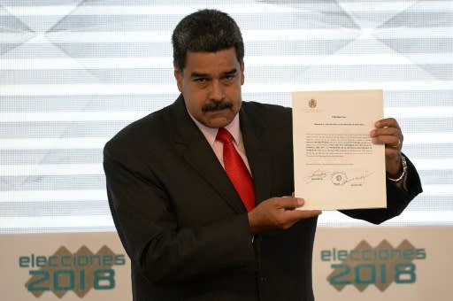 Maduro received his credentials for a second term, which would keep him in office until 2025, from the head of the election commission