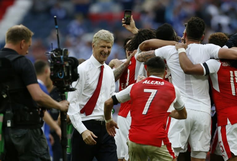 Arsenal's victory in the FA Cup final was rich vindication for French manager Arsene Wenger (2L), whose future is due to be decided at the team's board meeting in the coming days