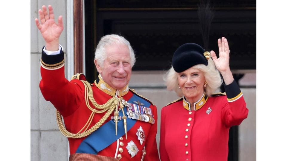 King Charles and Queen Camilla waving from the balcony of Buckingham Palace 