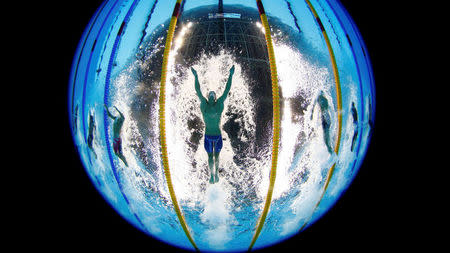 2016 Rio Olympics - Swimming - Preliminary - Men's 200m Individual Medley - Heats - Olympic Aquatics Stadium - Rio de Janeiro, Brazil - 10/08/2016. Michael Phelps (USA) of USA competes. Picture rotated 180 degrees. REUTERS/Stefan Wermuth