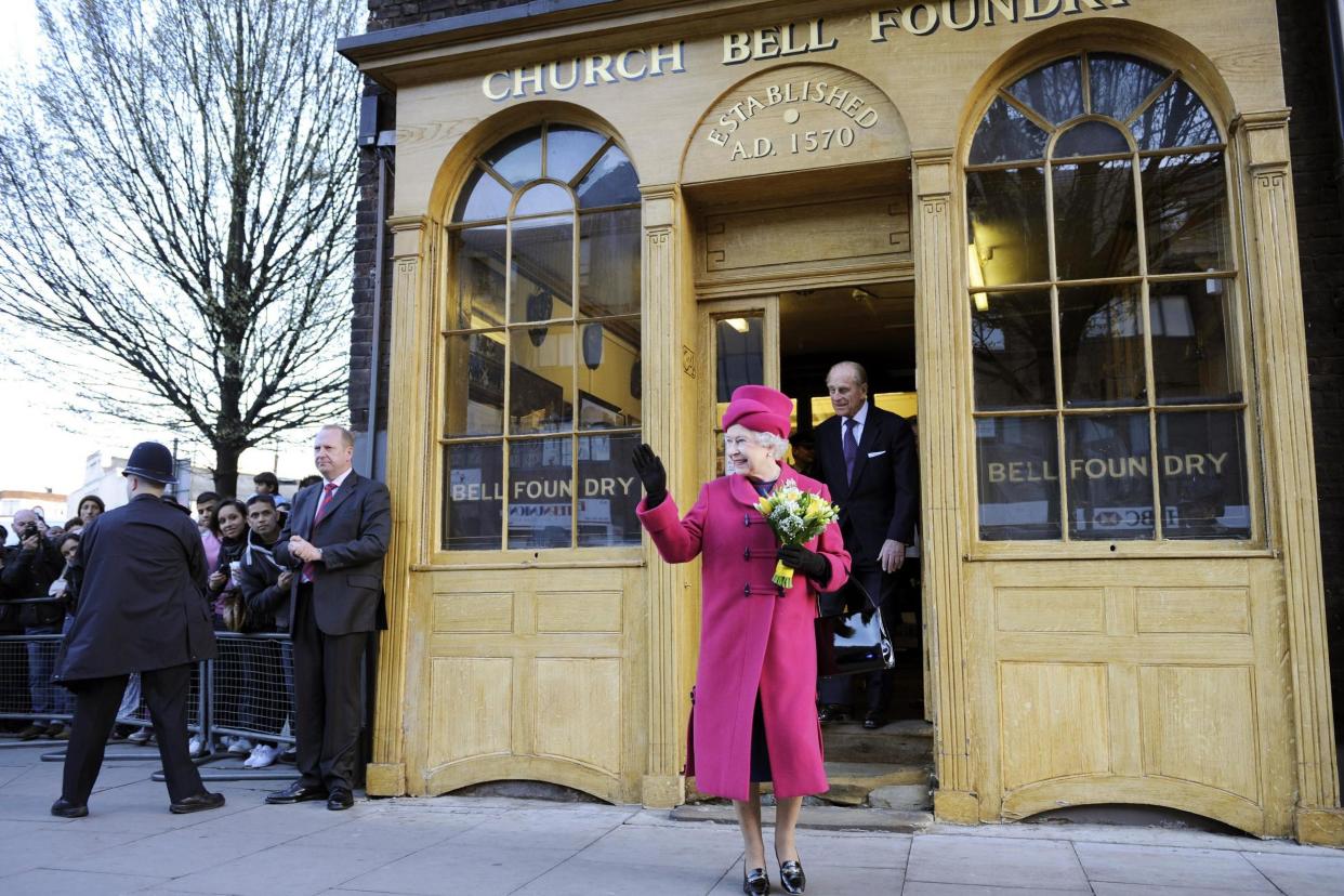 Queen Elizabeth II waves to the public as she leaves the Whitechapel Bell Foundry with her husband Prince Philip in 2009. The historic foundry, established in 1570, is set to be redeveloped under plans that campaigners have branded 'heritage vandalism': AFP via Getty Images