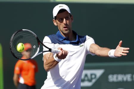 Mar 23, 2018; Key Biscayne, FL, USA; Novak Djokovic of Serbia hits a forehand against Benoit Paire of France (not pictured) on day four of the Miami Open at Tennis Center at Crandon Park. Paire won 6-3, 6-4. Mandatory Credit: Geoff Burke-USA TODAY Sports