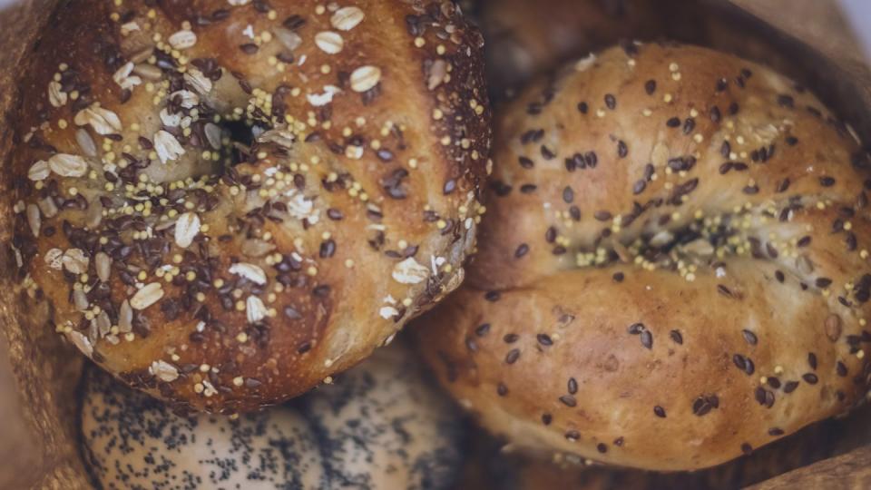 close up of fresh bagels in a paper bag