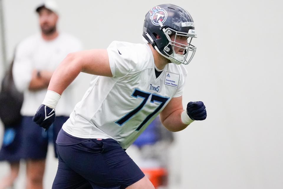 Tennessee Titans offensive lineman Peter Skoronski (77) runs through drills during the NFL football team's rookie minicamp, Saturday, May 13, 2023, in Nashville, Tenn. (AP Photo/George Walker IV)