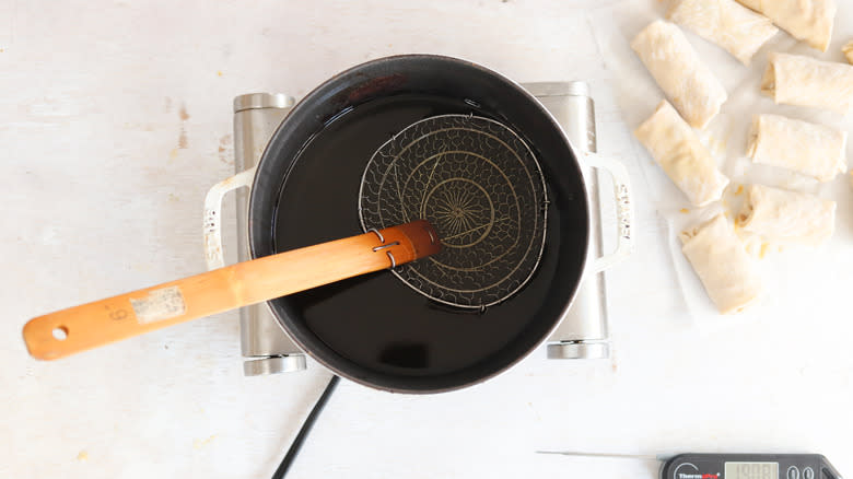 vegetable oil heating in a pot