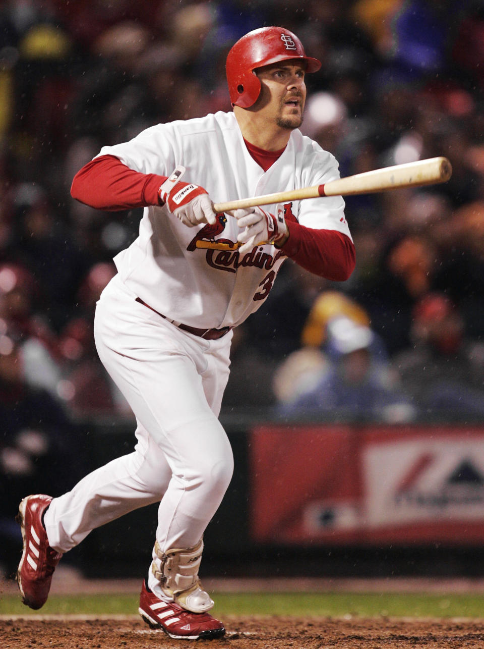 FILE - In this Oct. 14, 2004, file photo, St. Louis Cardinals' Larry Walker watches his two-run home run off Houston Astros pitcher Pete Munro in the fifth inning of Game 2 of the National League Championship Series in St. Louis. Walker is on the 2020 Hall of Fame ballot. On Tuesday, Jan. 21, 2020, the Baseball Writers' Association of America will announce the results of its 2020 Hall of Fame balloting. (AP Photo/Al Behrman, File)