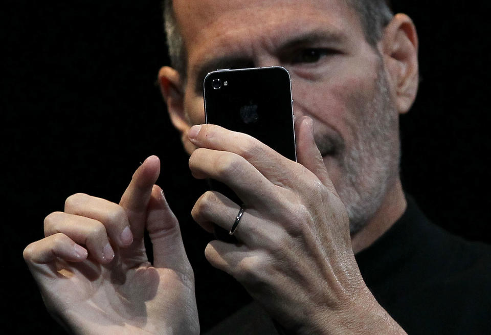 SAN FRANCISCO - JUNE 07: Apple CEO Steve Jobs demonstrates the new iPhone 4 as he delivers the opening keynote address at the 2010 Apple World Wide Developers conference June 7, 2010 in San Francisco, California. Jobs kicked off the annual WWDC with the official unveiling of the latest version of the iPhone. (Photo by Justin Sullivan/Getty Images)