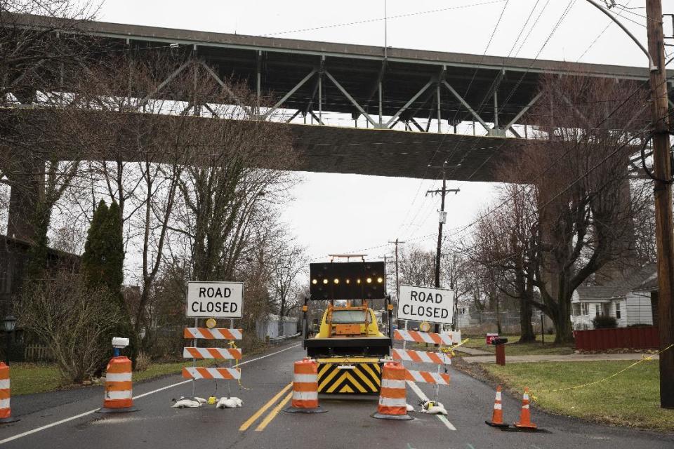 A road passing beneath the Delaware River Bridge is barricaded in Bristol, Pa., Monday, Jan. 23, 2017. Tens of thousands of drivers are being told to expect "extreme" delays for weeks because the bridge connecting Pennsylvania and New Jersey had to be shut down over a cracked steel truss. (AP Photo/Matt Rourke)