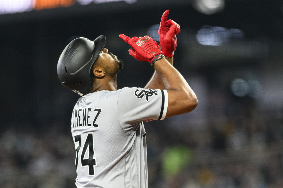 Chicago White Sox's Eloy Jimenez gestures as he reaches home plate after hitting a solo home run against the Seattle Mariners during the second inning of a baseball game, Saturday, June 17, 2023, in Seattle. (AP Photo/Caean Couto)