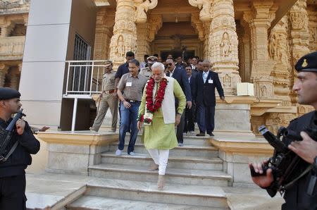 Hindu nationalist Narendra Modi (front C), then-prime ministerial candidate for India's main opposition Bharatiya Janata Party (BJP) and Gujarat's chief minister, walks inside the complex of a Hindu temple at Somnath in the western Indian state of Gujarat in this February 1, 2014 file photo. REUTERS/Amit Dave/Files