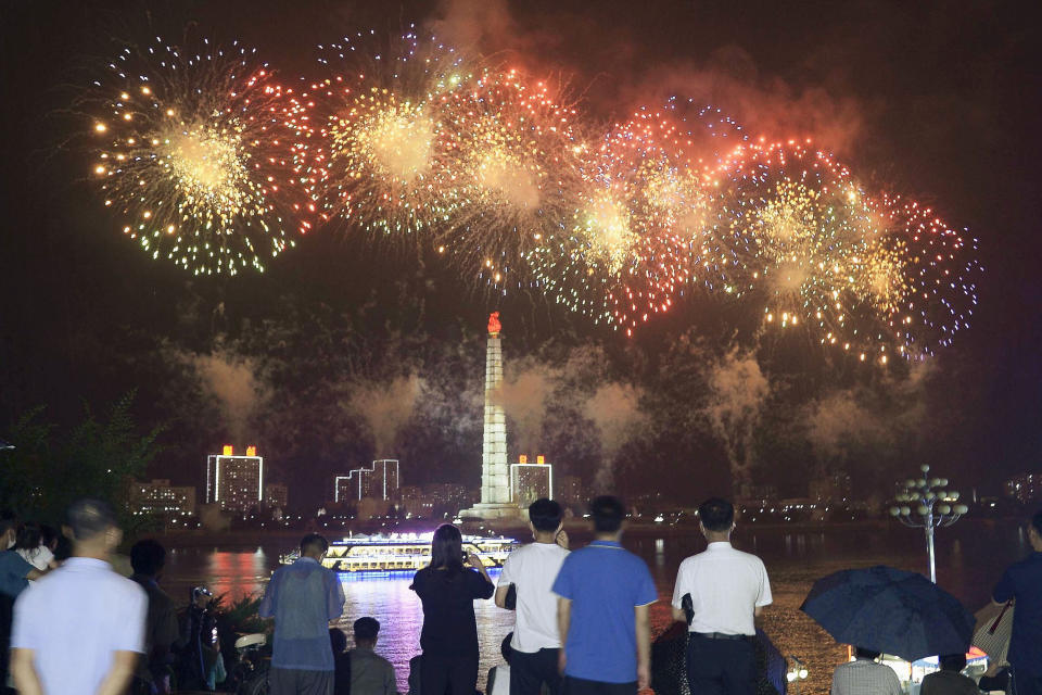 People watch fireworks exploded in Pyongyang, North Korea, Monday, July 27, 2020, marking the 67th anniversary of the end of the 1950-53 Korean War. (Kyodo News via AP)