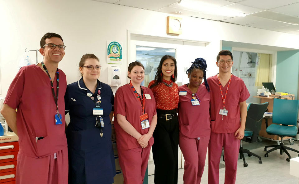 Dr Bhasha Mukherjee pictured with her colleagues in the hospital. (SWNS)