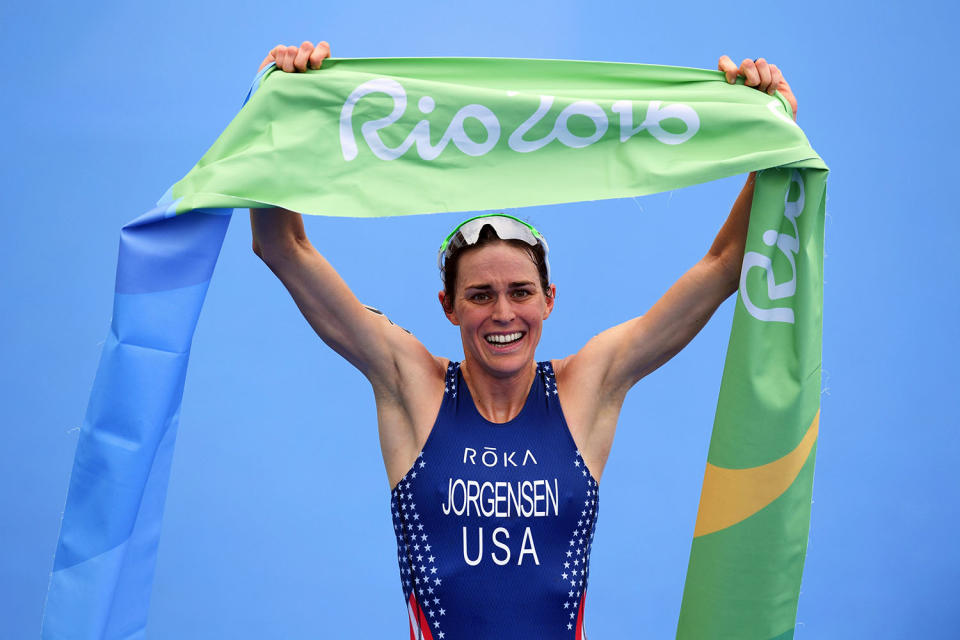 <p>Gwen Jorgensen of the United States celebrates as she wins gold during the Women’s Triathlon on Day 15 of the Rio 2016 Olympic Games at Fort Copacabana on August 20, 2016 in Rio de Janeiro, Brazil. (Photo by Matthias Hangst/Getty Images) </p>