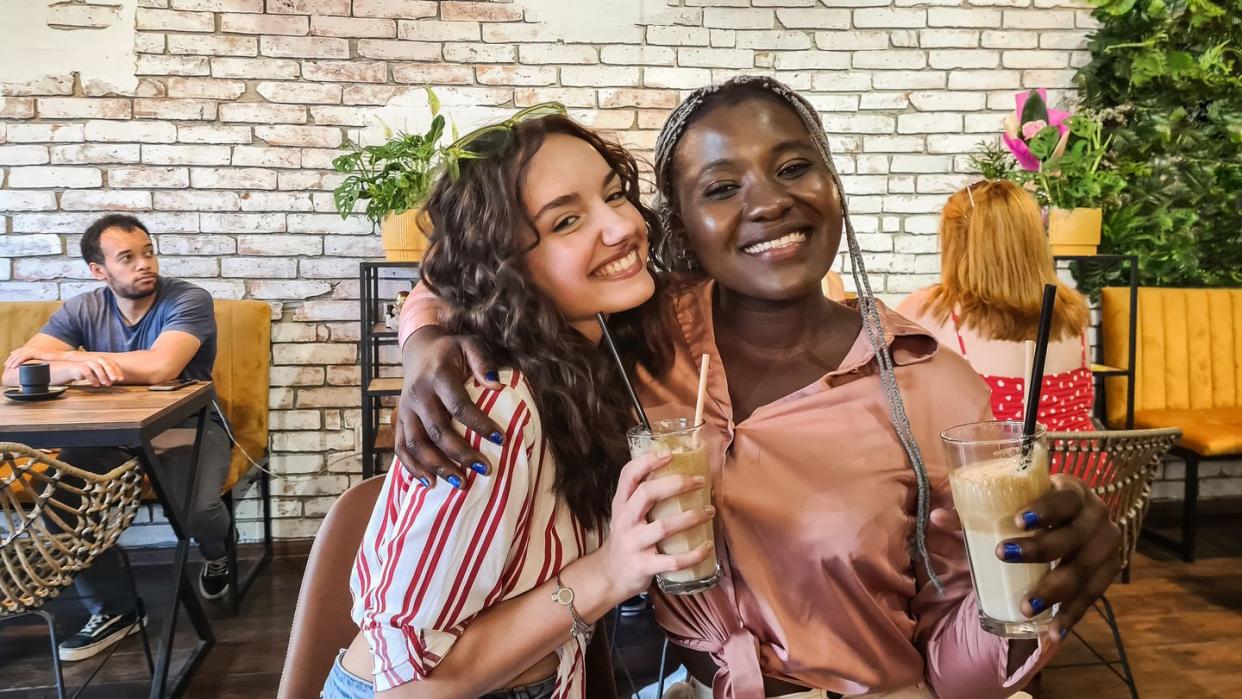 female friends drinking coffee in a café