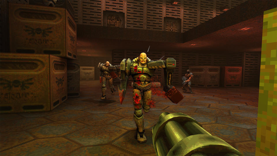 Fighting enemies using a minigun in Quake 2.