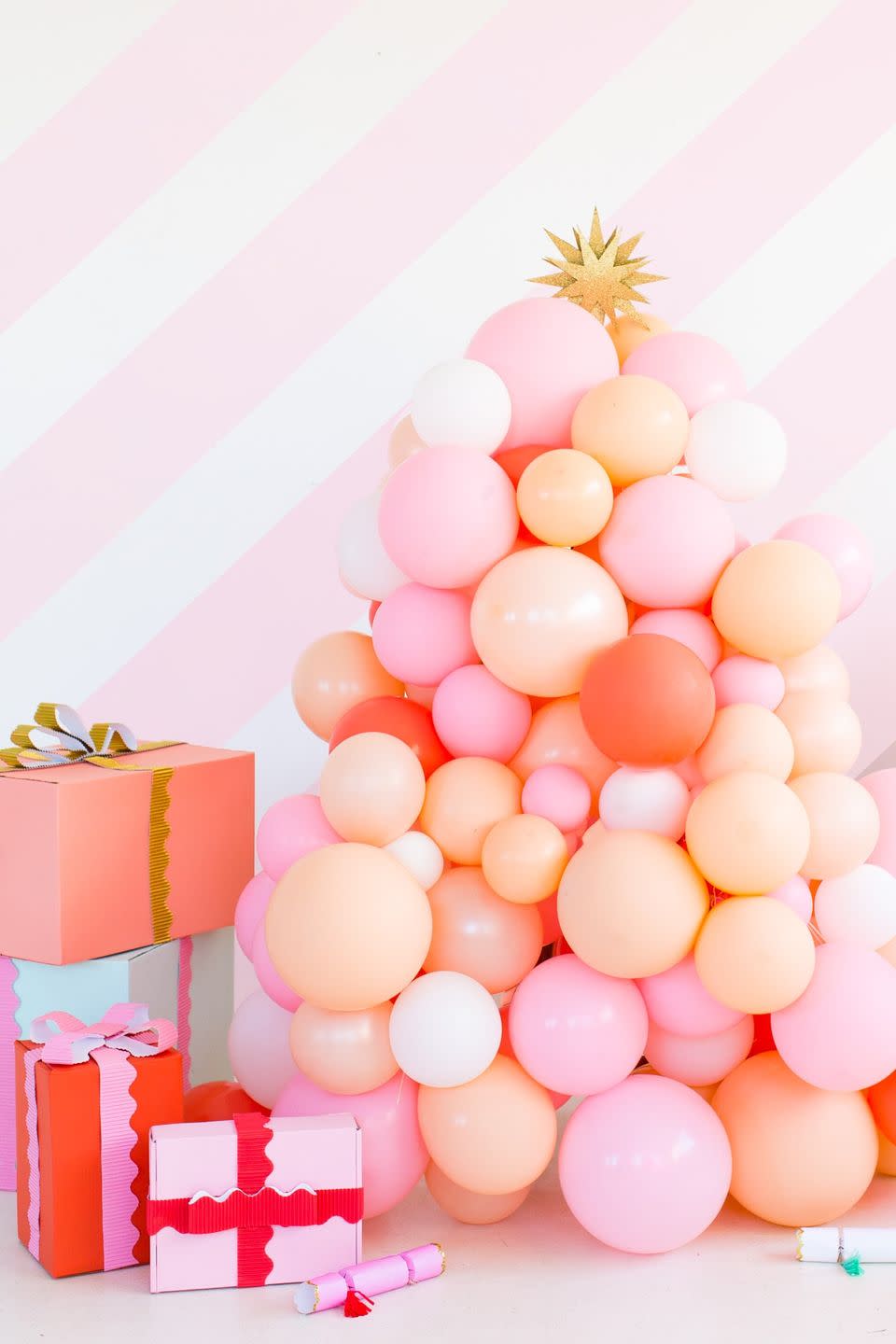 <p>How incredibly fun is this Christmas tree made entirely out of balloons? It's sure to be <em>the </em>topic of conversation at your holiday shindig. </p><p><strong>Get the tutorial at <a href="https://sugarandcloth.com/diy-balloon-christmas-tree/" rel="nofollow noopener" target="_blank" data-ylk="slk:Sugar & Cloth;elm:context_link;itc:0;sec:content-canvas" class="link ">Sugar & Cloth</a>.</strong></p><p><a class="link " href="https://www.amazon.com/Peace-Latex-Balloons-Light-Pink/dp/B01C5LKWL8/ref=sr_1_4?tag=syn-yahoo-20&ascsubtag=%5Bartid%7C10050.g.28872053%5Bsrc%7Cyahoo-us" rel="nofollow noopener" target="_blank" data-ylk="slk:SHOP PINK BALLOONS;elm:context_link;itc:0;sec:content-canvas">SHOP PINK BALLOONS</a></p>