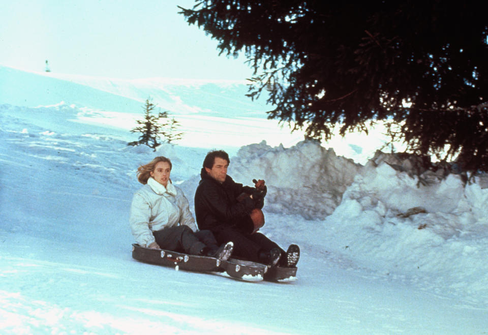 Actor Timothy Dalton and actress Maryam d'Abo on the set of 