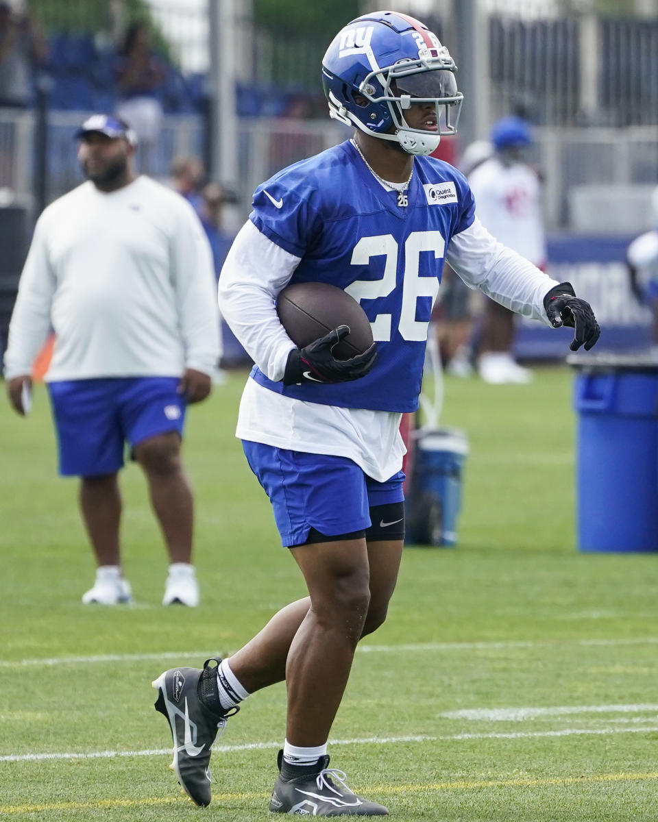 New York Giants running back Saquon Barkley runs a drill during training camp at the NFL football team's practice facility, Thursday, July 28, 2022, in East Rutherford, N.J. (AP Photo/John Minchillo)