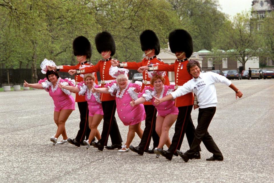 Lionel Blair and the Roly Polys teaching the Coldstream Guards how to tap dance outside the Wellington Barracks in London (Rebecca Naden/PA) (PA Archive)