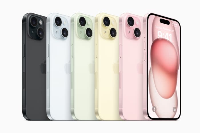 Six iPhones in various colors lined up side by side. 