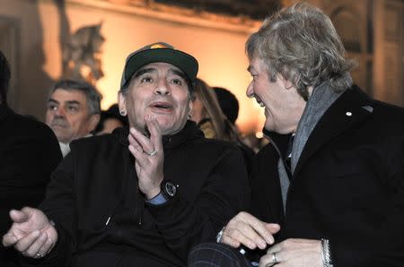 Argentinian soccer legend Diego Armando Maradona talks with former player Giancarlo Antognoni during the Italian soccer Hall of Fame 2017 event in Florence, Italy, January 17, 2017. REUTERS/Paolo Lo Debole