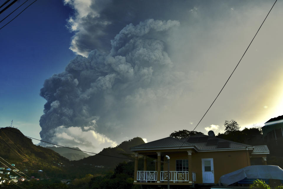 Ash rises into the air as La Soufriere volcano erupts on the eastern Caribbean island of St. Vincent, Tuesday, April 13, 2021. (AP Photo/Orvil Samuel)