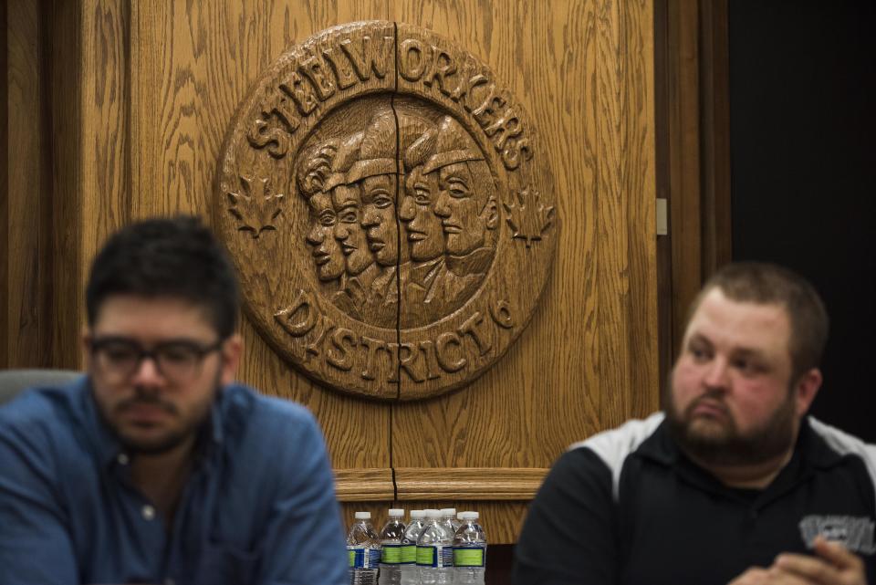 A wooden&nbsp;cabinet with a sign reading United Steel Workers sits in a boardroom where&nbsp;the roundtable took place.