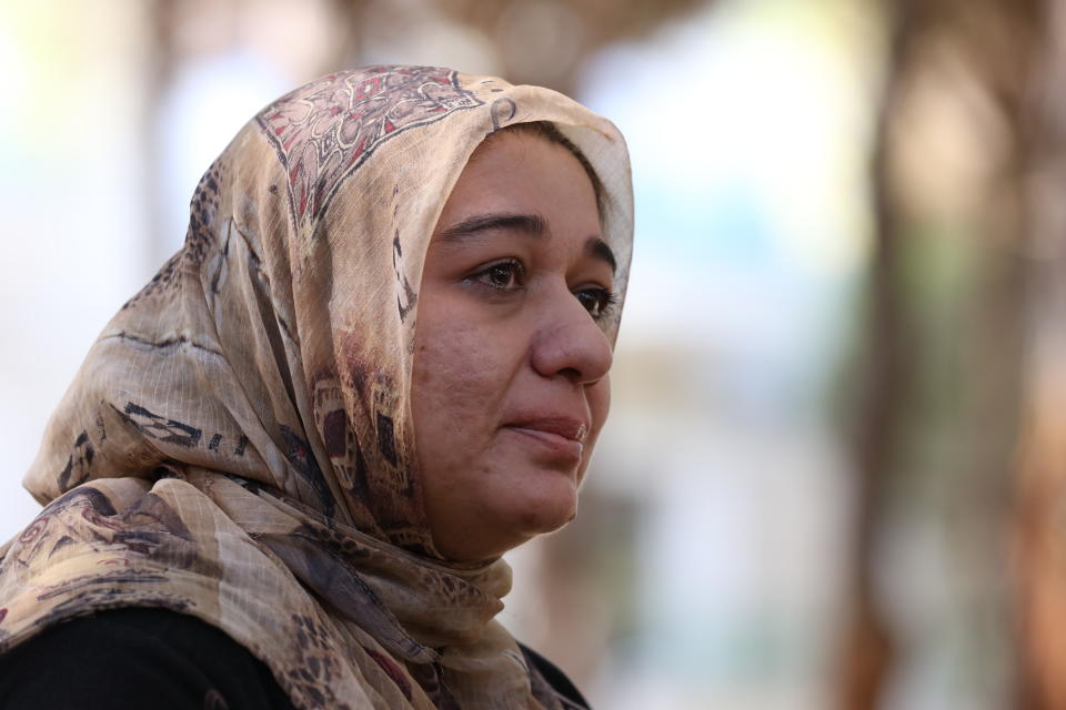 Ghazaal Habibyar, one of the 457 Afghan evacuees housed in Albania, pauses during an interview with The Associated Press, Sunday, Aug. 29, 2021. Habibyar, an Afghan evacuee, is now housed in a tourist resort in Albania. But she can hardly rest when remembering the difficulties she and her family faced getting onto the plane and leaving her homeland. Fearing the Taliban in power and the future of her children, she decided to leave, pledging to her 6-year-old son that they would come back one day to help Afghanistan rebuild. (AP Photo/Franc Zhurda)