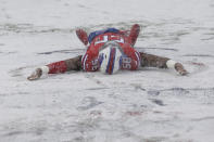 <p>Buffalo Bills’ Ryan Davis makes a snow angel on the field before an NFL football game between the Buffalo Bills and the Indianapolis Colts, Sunday, Dec. 10, 2017, in Orchard Park, N.Y. (AP Photo/Seth Wenig) </p>