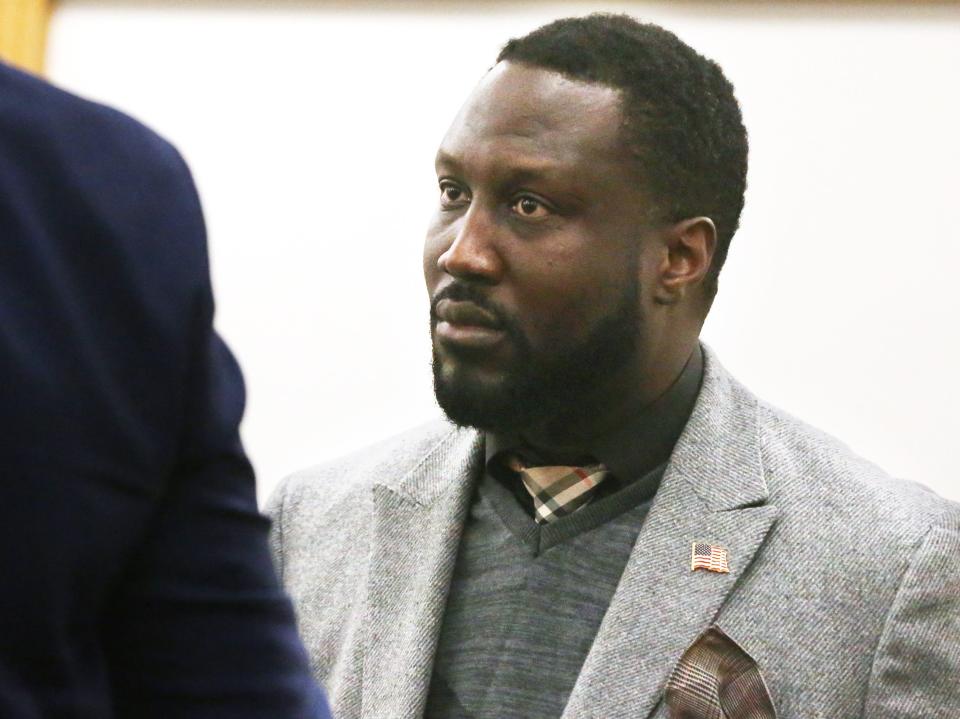 Former Strafford County Sheriff Mark Brave glances at his attorney, Leif Becker, in Rockingham County Superior Court Tuesday, March 26, 2024.