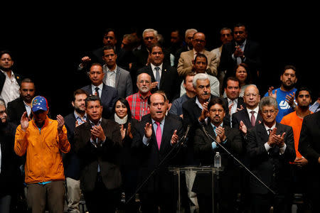 Julio Borges (C), President of the National Assembly and deputy of the Venezuelan coalition of opposition parties (MUD), talks during a meeting of the MUD in Caracas, Venezuela July 3, 2017. REUTERS/Carlos Garcia Rawlins