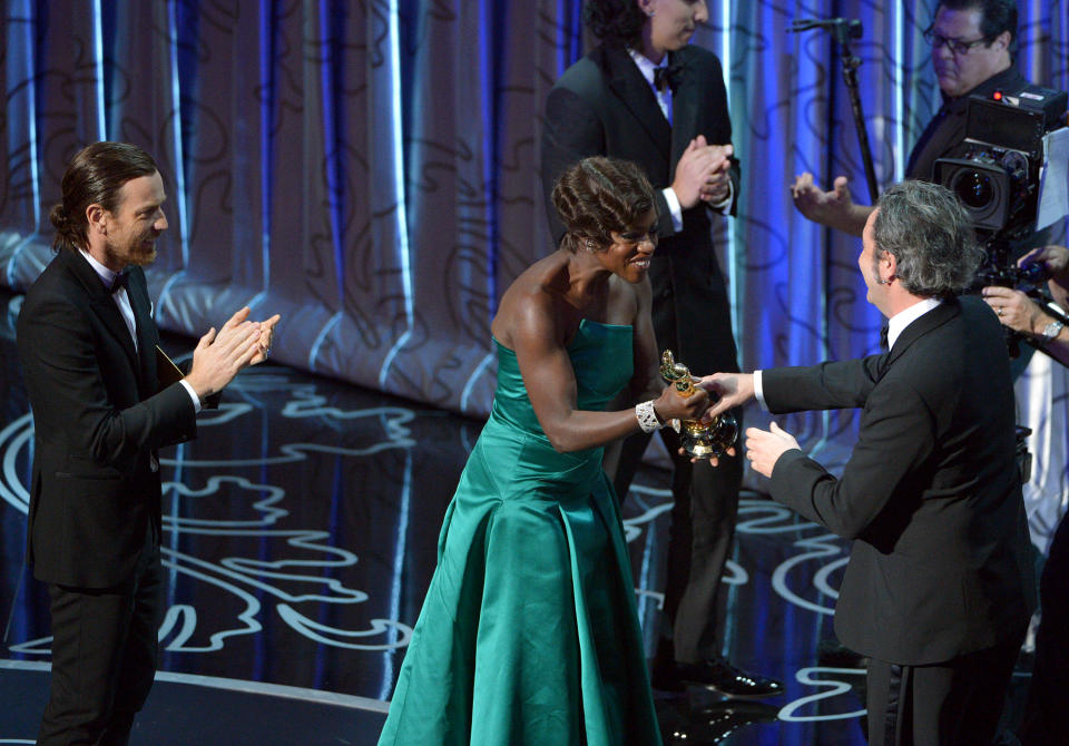 Presenters Ewan McGregor, left, and Viola Davis present Paolo Sorrentino with the award for best foreign language film of the year for “The Great Beauty” during the Oscars at the Dolby Theatre on Sunday, March 2, 2014, in Los Angeles. (Photo by John Shearer/Invision/AP)