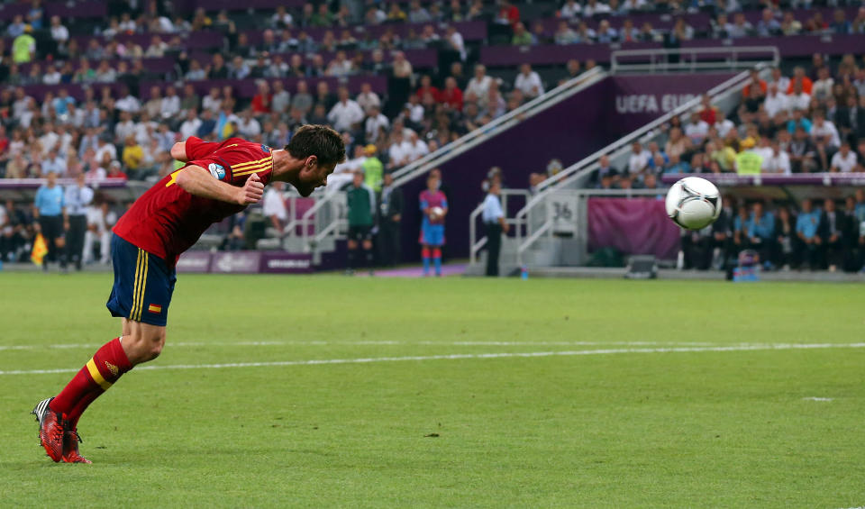 DONETSK, UKRAINE - JUNE 23: Xabi Alonso of Spain scores the first goal during the UEFA EURO 2012 quarter final match between Spain and France at Donbass Arena on June 23, 2012 in Donetsk, Ukraine. (Photo by Alex Livesey/Getty Images)