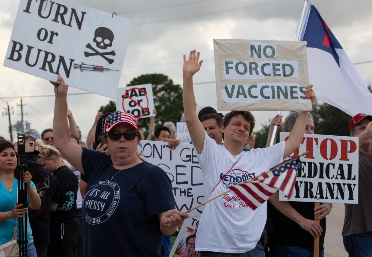 Protesters object to Houston Methodist Hospital’s requirement that employees get vaccinated for Covid-19 (AP)