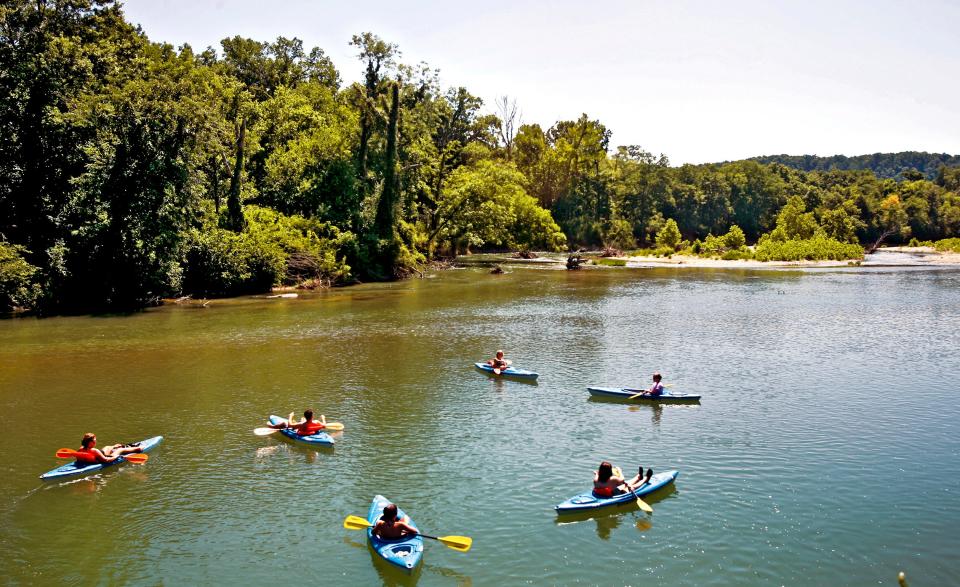 Tourists enjoy the Illinois River in 2009. The water quality of the river and other streams and water bodies in the watershed have noticeably declined over time, witnesses have testified during a landmark case that has been in the courts since 2005.