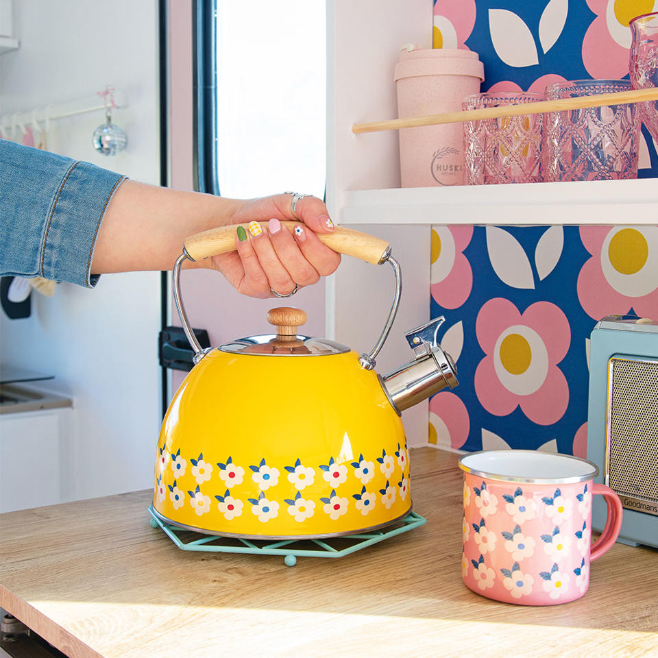 Caravan makeover with kitchen worktop and yellow kettle