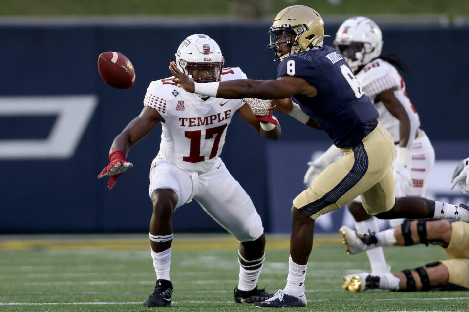 ANNAPOLIS, MARYLAND - OCTOBER 10: Quarterback Dalen Morris #8 of the Navy Midshipmen pitches the ball in front of defensive end Arnold Ebiketie #17 of the Temple Owls at Navy-Marine Corps Memorial Stadium on October 10, 2020 in Annapolis, Maryland. (Photo by Rob Carr/Getty Images)