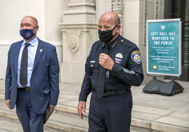 BEVERLY HILLS, CA - MAY 12, 2021: Matthew Moon, left, Special Agent in charge of the criminal division, FBI, Los Angeles, and Dominick Rivetti, Interim Beverly Hills Police Chief, stand together after a press conference outside of Beverly Hills City Hall where they announced and discussed the arrest of 3 gang members in the armed robbery at a popular Beverly Hills restaurant on March 4, 2021, where a $500,000 watch was stolen. (Mel Melcon / Los Angeles Times)