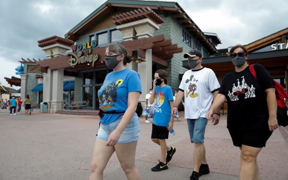 Masked visitors at Disney World in Florida - Reuters