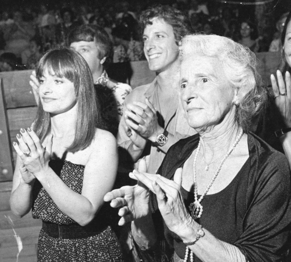 Patti LuPone and her family applaud a performance of the Long Island Philharmonic on August 10, 1980. From left to right: Patti Lupone, her mother Louise "Pat" LuPone, and her brother Robert LuPone.
