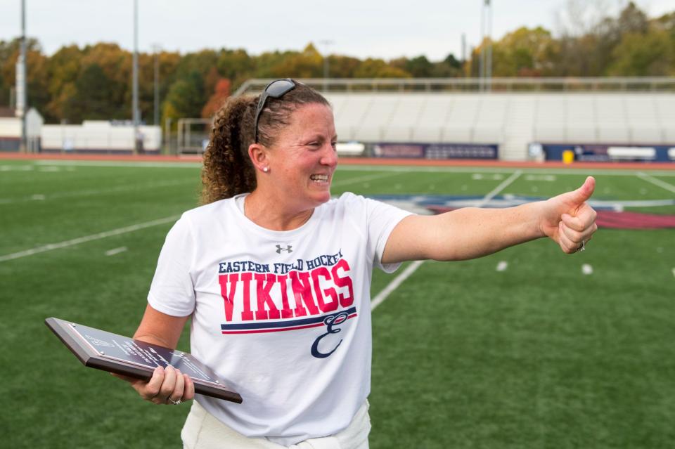 Eastern field hockey head coach Danyle Heilig gives a thumbs-up to her team after earning her 500th win Thursday, Nov. 1, 2018 in Voorhees, N.J. Eastern beat Kingsway 8-0 for the South Jersey Group 4 championship.