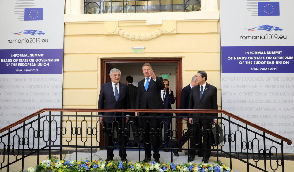 Romanian President Klaus Werner Ioannis, center, speaks with European Parliament President Antonio Tajani, left, and Cypriot President Nicos Anastasiades, right, prior to a round table meeting at an EU summit in Sibiu, Romania, Thursday, May 9, 2019. European Union leaders on Thursday start to set out a course for increased political cooperation in the wake of the impending departure of the United Kingdom from the bloc. (Ludovic Marin, Pool Photo via AP)