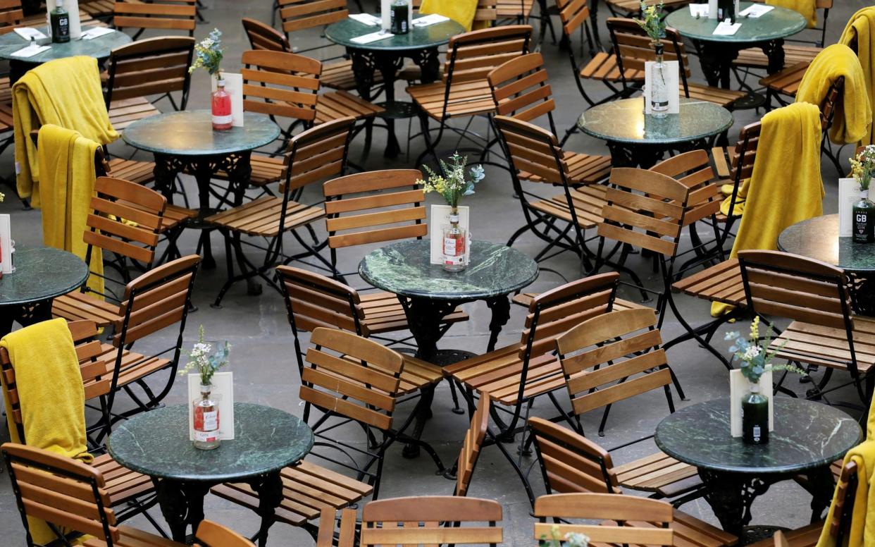 Empty chairs and tables  - Simon Dawson