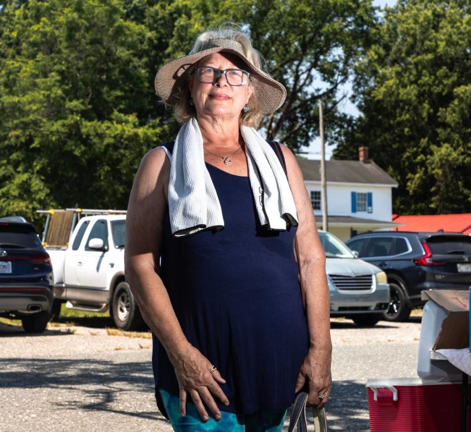 Tina Caruso poses for a portrait in Selma, N.C. while shopping at the 301 Endless Yard Sale Friday, June 14, 2024.