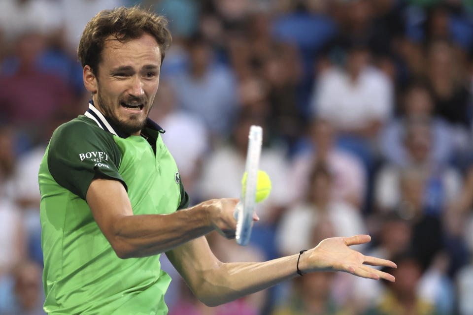 Daniil Medvedev of Russia plays a forehand return to Felix Auger-Aliassime of Canada during their third round match at the Australian Open tennis championships at Melbourne Park, Melbourne, Australia, Saturday, Jan. 20, 2024. (AP Photo/Asanka Brendon Ratnayake)