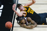 Illinois guard Ayo Dosunmu (11) and Iowa center Luka Garza (55) watches as the ball goes out of bounds in the first half of an NCAA college basketball game at the Big Ten Conference tournament in Indianapolis, Saturday, March 13, 2021. (AP Photo/Michael Conroy)