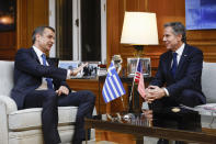 Greece's Prime Minister Kyriakos Mitsotakis, left, speaks with the U.S. Secretary of State Antony Blinken during their meeting at Maximos Mansion in Athens, Greece, on Monday, Feb. 20, 2023. Blinken will be on a two-day trip in Athens, after his visit to Turkey, to meet with the country's leadership and launch the fourth round of the US-Greece Strategic Dialogue. (Louiza Vradi/Pool Photo via AP)