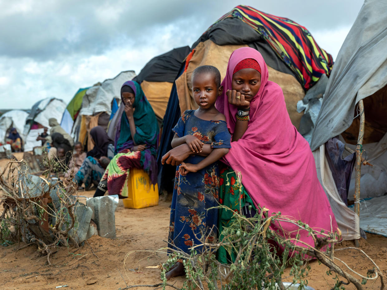 Families, consisting of mainly women and children, arrive at a camp near Mogadishu, Somalia, in 2022. 