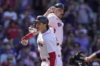 Boston Red Sox's Triston Casas, front, celebrates his two-run home run with Adam Duvall, top right, in the sixth inning of a baseball game against the Los Angeles Dodgers, Sunday, Aug. 27, 2023, in Boston. (AP Photo/Steven Senne)